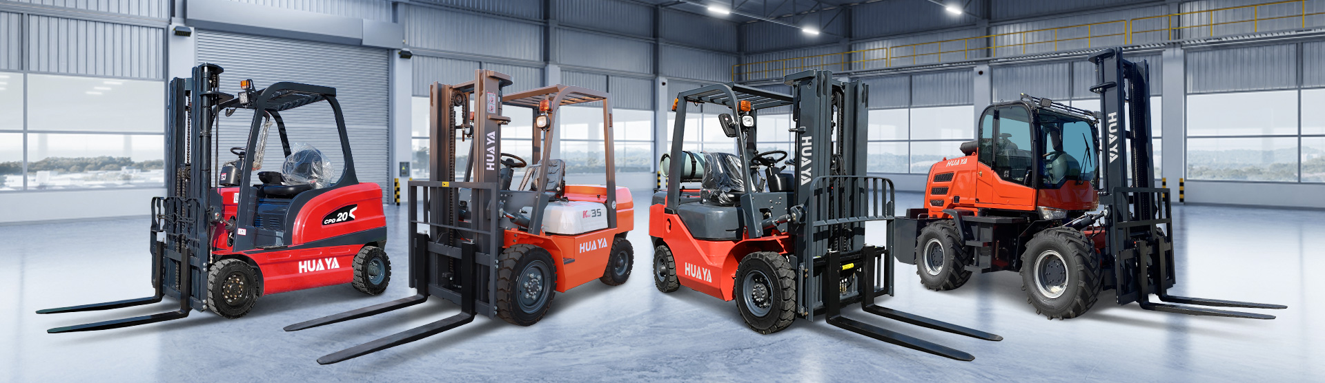 Four HUAYA forklifts of different classes standing on a polished concrete warehouse floor, showing how each machine meets the slab through its tyres
